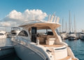 A sleek boat docked at a sunny marina, reflecting in clear blue water with fluffy clouds overhead, creating a serene atmosphere of adventure and fr...